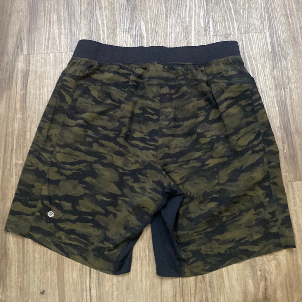 Lululemon.Men’s shorts.Waist 29”.Green Black Camo Elastic Drawstring.3 Pockets